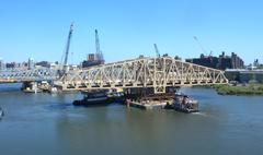 New Willis Avenue Bridge being positioned beside the old Willis Avenue Bridge on a sunny late morning