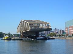 Willis Avenue Bridge over East River Plaza on sunny morning from Randalls Island shore
