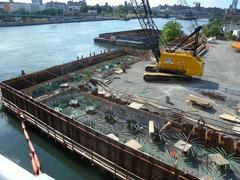 View of possible footings on upstream Bronx side of Willis Bridge under mostly sunny sky
