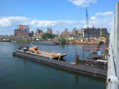 Barges docked upriver on Harlem River on a sunny afternoon
