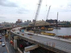 Rainy afternoon view of ramp under construction connecting Harlem River Drive to new Willis Avenue Bridge