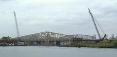 New and old Willis Avenue Bridges viewed northwest from Randalls Island shore on a cloudy afternoon