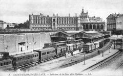 Historic train station platforms and tracks with vintage train cars at Gare Saint-Germain-en-Laye around 1900