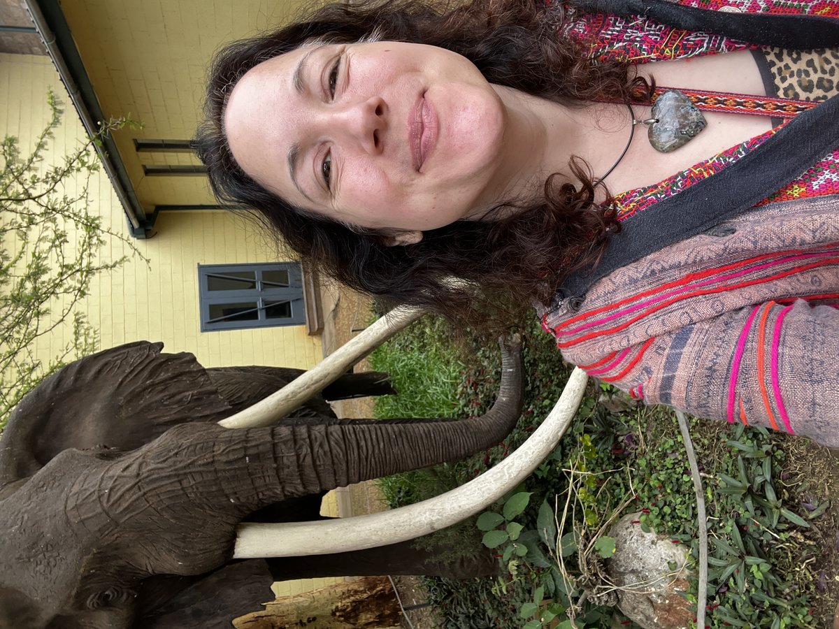 Alice Woods posing with an elephant statue at Nairobi National Museum