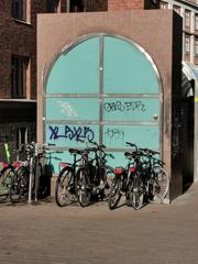 Bicycles parked at Vuorikatu street near Helsinki University metro station entrance