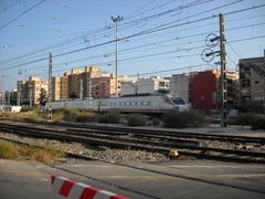 A train traveling toward Alicante with a scenic background