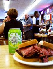 Close-up of a hot pastrami sandwich on rye bread