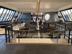Interior of Vltavská metro station with escalators and modern lighting