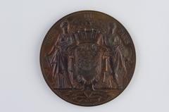 Bronze commemorative medal depicting the inauguration of Saint-Ambroise Church on November 11, 1869, with neo-Gothic church facade and winged genius holding church plans