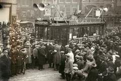 Crowd surrounding the Zilvertram tram at Beursplein Amsterdam during a fundraising campaign for Waterland flood victims in 1926
