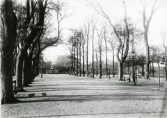 Tree-lined alley with benches and the Abondance statue by Antoine Coysevox near the castle