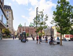 Belgrade Republic Square with tall monument and surrounding historic buildings under blue sky