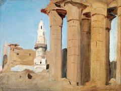 Ancient Egyptian temple ruins with massive stone columns