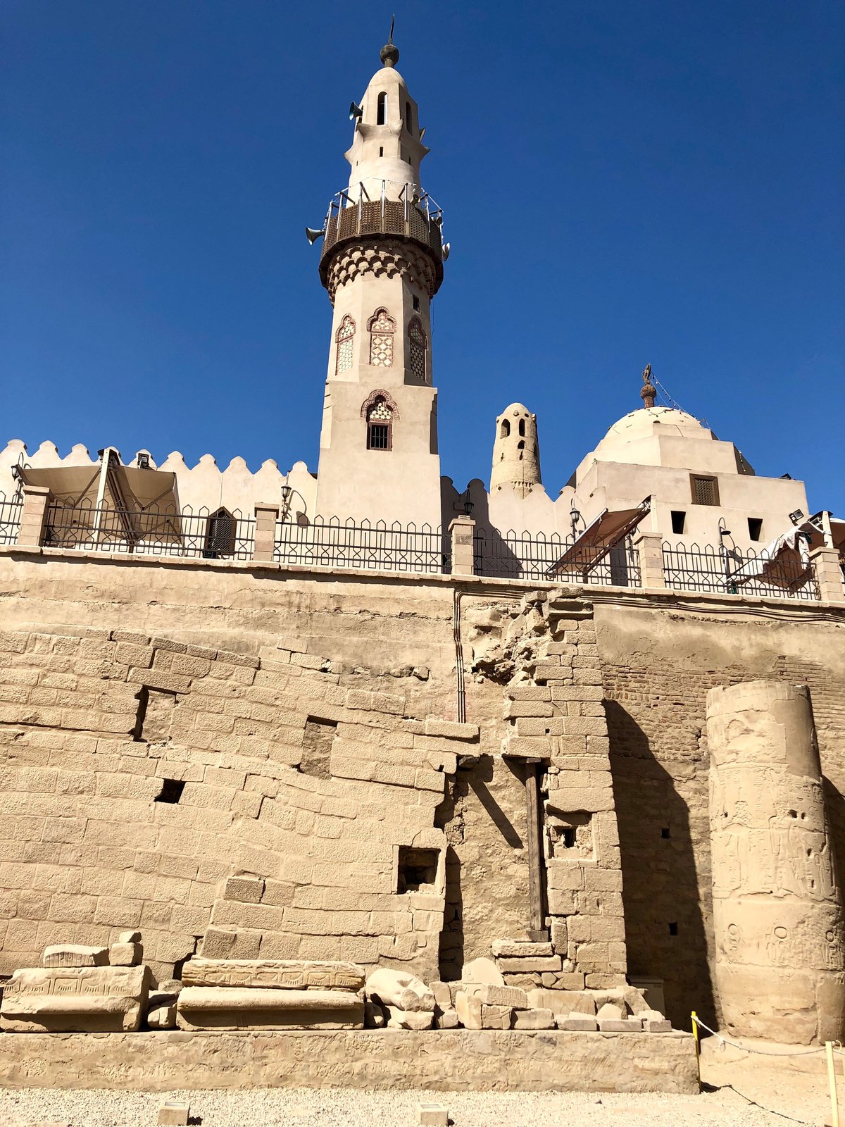 Luxor Temple with Abu Haggag Mosque on top, ancient Egyptian temple in the city of Luxor with historical ruins and Islamic mosque built over it