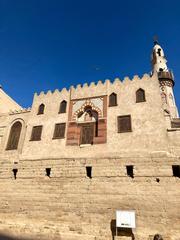 Luxor Temple with Abu Haggag Mosque built atop, located in Luxor, Egypt, showing ancient stone pillars and detailed structures in daylight