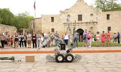 502nd Civil Engineer Squadron Explosive Ordnance Disposal technicians demonstrate bomb disposal robot at Fiesta 2014 Air Force Day at Alamo