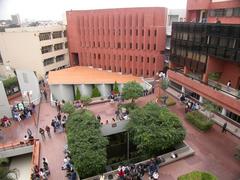 Main plaza of Universidad del Pacífico in Lima, Peru with historic architecture and palm trees