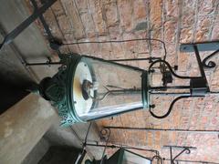 Vintage gas lamp on a post against a blue sky