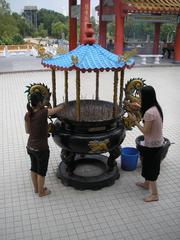 Burning joss sticks at Thean Hou Temple Kuala Lumpur