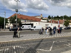 Malostranská metro station platform with trains and passengers