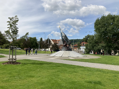 Malostranská metro station entrance in Prague with people walking nearby