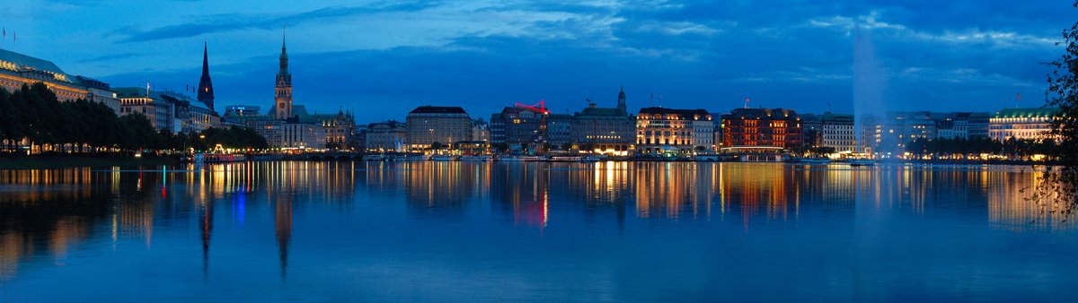 Panoramic view of the Alster lake surrounded by Hamburg cityscape