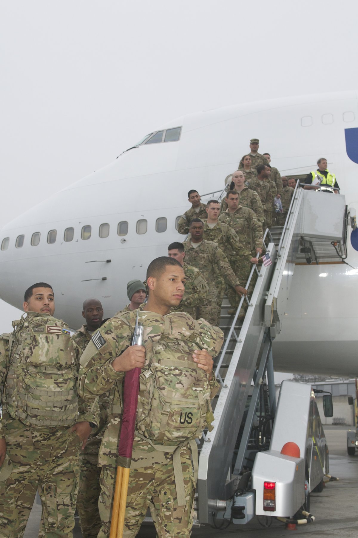 Soldiers of 43rd Assault Helicopter Battalion exiting plane at Nuremberg Airport for Operation Atlantic Resolve NATO training