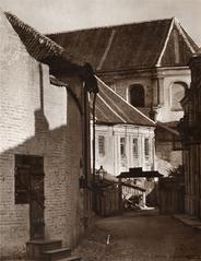 Historic view of Vilnia city in Piaski district showing Franciskanskaja street with the Church of the Assumption of the Blessed Virgin Mary and Franciscan monastery