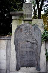 Funerary monument surrounded by trees in Olšany Cemetery Prague