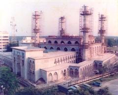 Construction of Sultan Ahmad Shah Mosque with scaffolding and workers
