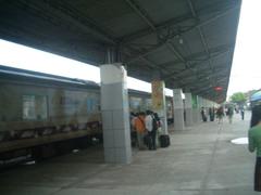 Railway station building in Ho Chi Minh City with people and vehicles around