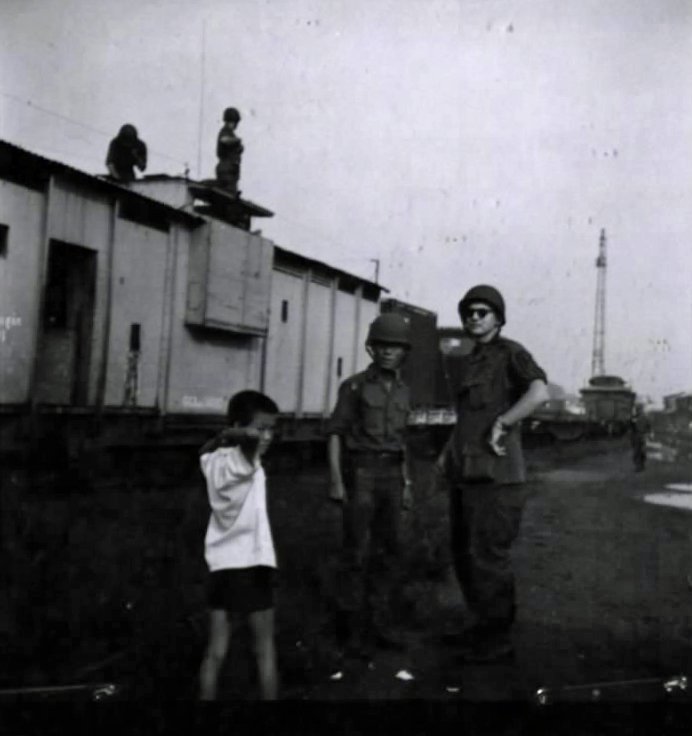 US Railroad Security Advisor conferring with ARVN security commander at Saigon railyard
