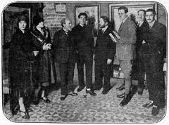 Group of people at the opening of the art exhibition in Haagsche Kunstkring featuring works by Ernst Leyden in 1925