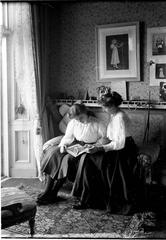 Lady Honor and Lady Morvyth Ward reading inside Government House Sydney in early 1900s