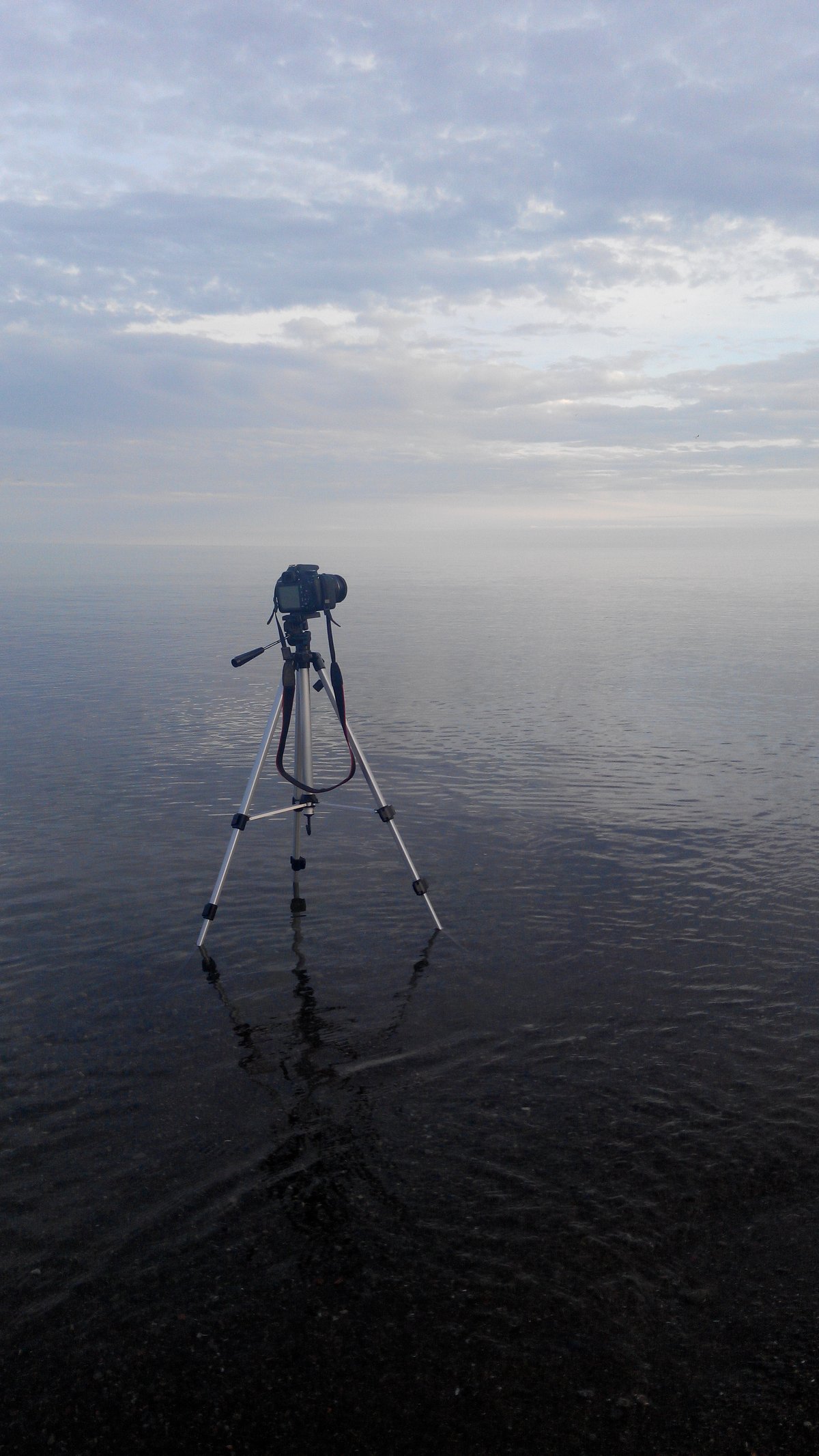 Canon EOS Rebel T5 camera on tripod in Lake Ontario