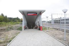 Belokamennaya MCC station platform with tracks and overhead structures