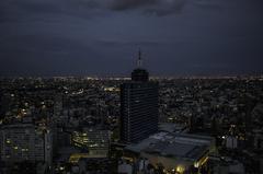 Aerial view of Mexico City with a wide urban landscape and mountains in the background