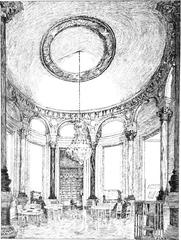Grande salle main room of Bibliothèque de l'Opéra with ornate architectural details and rows of bookshelves