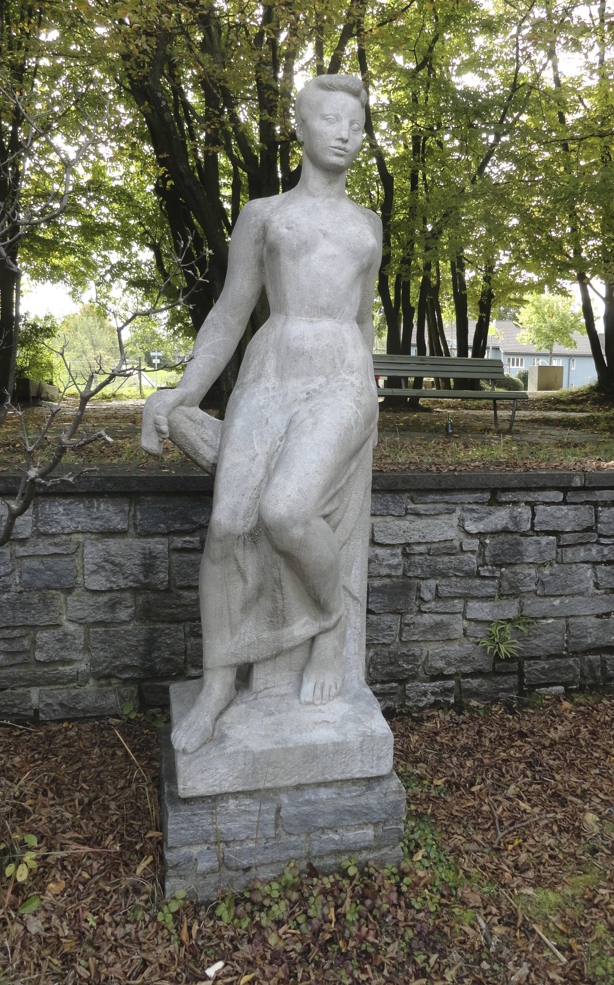 Seated statue at Bänninger Kirche in Egg, Zürich, Switzerland