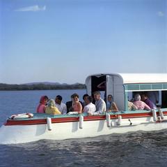 Jacqueline Kennedy takes a boat ride on Lake Pichola with dignitaries in Udaipur, India