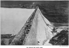 Historical Periyar Dam in 1899 surrounded by lush greenery and water reservoir