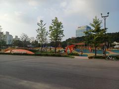 Scenic view of Boramae Park with a colorful playground