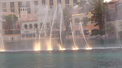 Fountains of Bellagio water show at night with illuminated jets of water