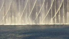 Fountains of Bellagio in Las Vegas at night with water jets and colorful lights