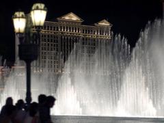 Caesars Palace fountains with illuminated water jets during nighttime