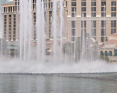 Fountains of Bellagio water show at night with illuminated jets and building lights