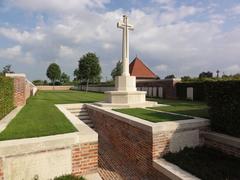 Ghissignies British Cemetery in Nord, France with uniform rows of white war graves under a clear sky