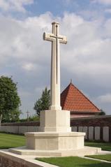 Ghissignies British Cemetery in Nord, France with rows of white gravestones and well-maintained greenery
