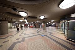 Top interior level of Édouard-Montpetit metro station with modern architectural design and lighting