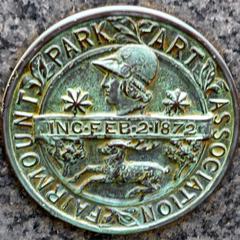Medallion on the back of the Puma statue by Fairmount Park Art Association